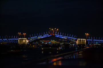 Raising bridges across the Neva River at night