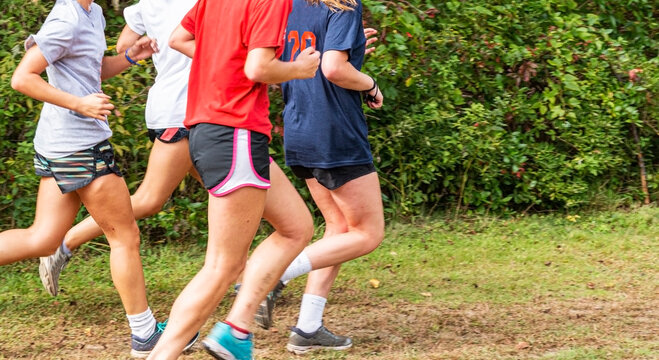 Girls running together in a park