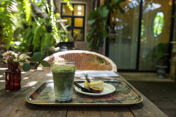 Matcha green tea and cheesecake in garden