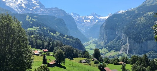 Lauterbrunnen valley with a gorgeous waterfall and Swiss Alps in the background, Berner Oberland,...