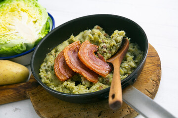 Trinxat de la Cerdaña. Typical recipe from the north of Catalonia cooked with white cabbage, potato and bacon.