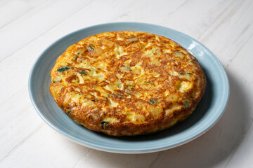 Spanish omelette cooked with potato and zucchini. Typical recipe from the central area of ​​Spain.