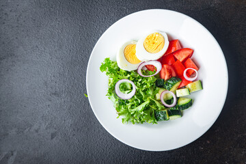 salad eggs, vegetable, cucumber, tomato, lettuce veggie healthy meal snack diet on the table copy space food background  keto or paleo diet vegetarian food no meat