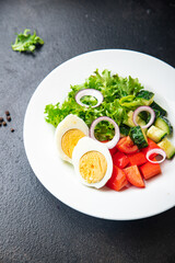 salad eggs, vegetable, cucumber, tomato, lettuce veggie healthy meal snack diet on the table copy space food background  keto or paleo diet vegetarian food no meat