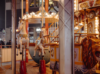 Vintage carousel with artificial horses on it
