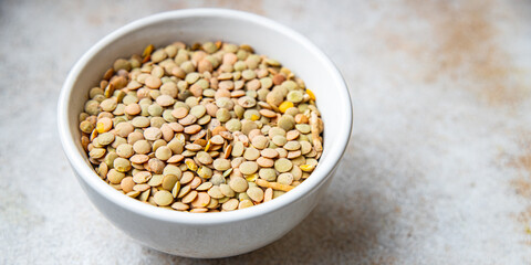 green lentils raw legumes healthy meal snack diet on the table copy space food background rustic. top view keto or paleo diet veggie vegan or vegetarian food