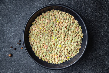 green lentils raw legumes healthy meal snack diet on the table copy space food background rustic. top view keto or paleo diet veggie vegan or vegetarian food