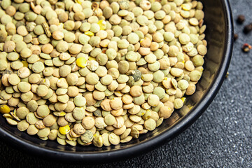green lentils raw legumes healthy meal snack diet on the table copy space food background rustic. top view keto or paleo diet veggie vegan or vegetarian food