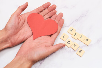 Alphabet blocks with the word self love. concept love yourself.
