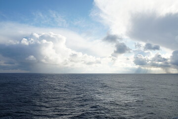 View from vessel on heavy rainfall clouds bringing abundant rainfall and atmospheric precipitation...