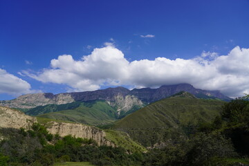 Landscape with sky and clouds. Rocks and hills