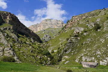 Landscape with sky and clouds. Rocks and hills