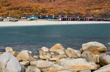 The coast of the sea bay with cottages for tourists.
