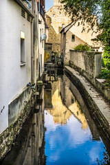 Fototapeta na wymiar White Buildings City Center Aure River Reflection Bayeux France