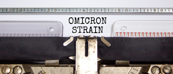 Covid-19 new omicron virus variant symbol. Concept words Omicron strain typed on retro typewriter. Medical and COVID-19 pandemic new omicron variant strain mutation concept.