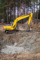Excavator working on a construction site in the countryside
