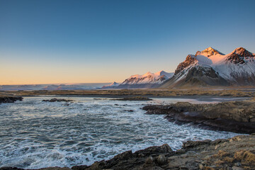 The waves hitting the beach of Stokksnes in Iceland