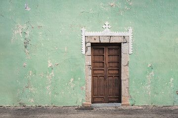 old wooden door mint green wall - 473024845