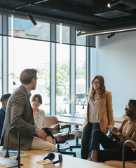 Group of Businesspeople in a Casual Meeting at their Company