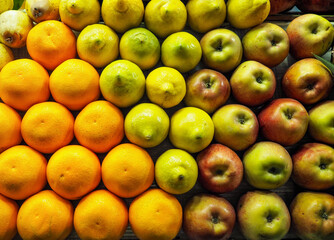 Oranges, pears, lemons and apples arranged nicely on street fruit market in Morocco