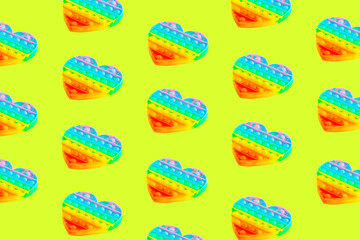 Patern colorful pop-it toys for kids. Light green background.