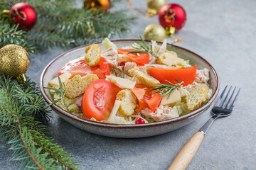 Christmas salad. Chicken Cesar salad with croutons, grated cheese , tomato