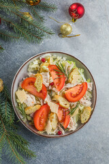 Christmas salad. Chicken Cesar salad with croutons, grated cheese , tomato