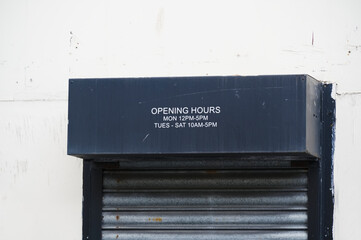 Opening hours shop sign Monday to Friday daytime closed Sunday