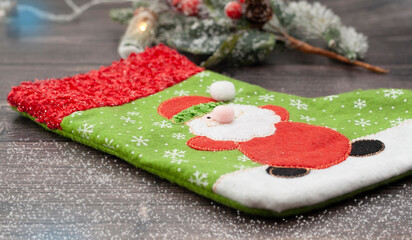 Christmas wooden background with a tet and a Christmas tree toy.