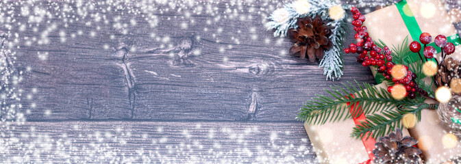 Christmas wooden background with a tet and a Christmas tree toy.