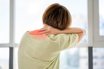 Neck pain, woman suffering from backache at home