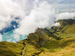 Aerial image of the Brienzer Rothorn steam train ascending onto the summit with Dirrengrind cliff...