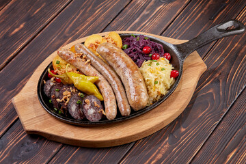 Traditional german fried meat with boiled potatoes, red cabbage and vegetables