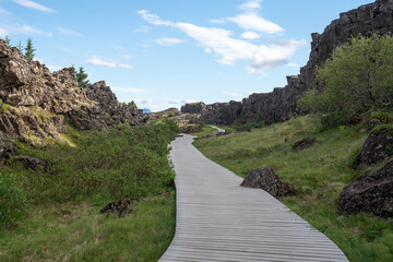 Fototapeta na wymiar Empty pathway with mountains on either side in a continental rift in Iceland