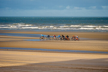 Competitors during Bike racing on French - Belgium Border, beach endurance