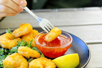 Grilled tiger shrimps with spice and lemon in bar outside. seafood