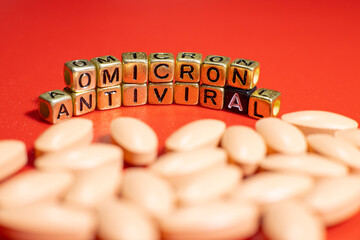 Omicron antiviral tablets. Antiviral drugs. Inscription omicron from letters