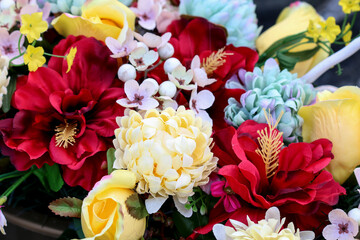 Naklejka na ściany i meble A beautiful floral arrangement with artificial flowers