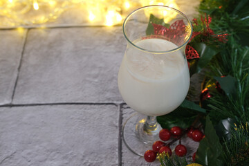Christmas milk in a glass for Santa Claus, close up, selective focus.