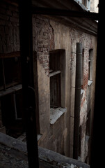 Fototapeta na wymiar The windows of an abandoned high-rise building