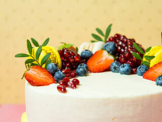 beautiful birthday cake decorated with berries with place for text