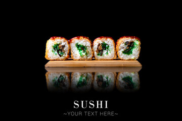 Tempura Japanese sushi inside out roll with mushrooms and hiyashi wakame seaweed, cream cheese. Served on wooden board. Fried, baked dish on black background with reflection. Banner with Text space
