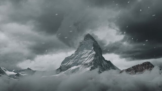 view to the majestic Matterhorn mountain covered with clouds and snow