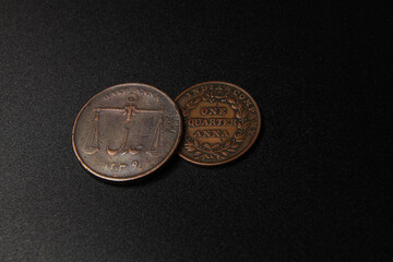 Old coins of India on black background