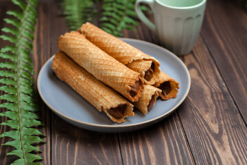 Wafer rolls with condensed milk. Thin and Crispy Waffle. Selective focus
