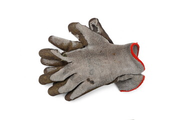 Used old dirty torn worker's gloves isolated on white background.