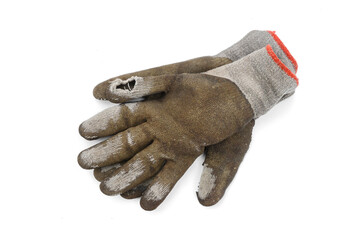 Used old dirty torn worker's gloves isolated on white background.