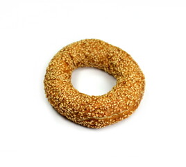 bagel with seeds isolated on white background. Fresh breakfast bread bagel roll with seeds isolated on white background.