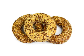 bagel with seeds isolated on white background. Fresh breakfast bread bagel roll with seeds isolated on white background.