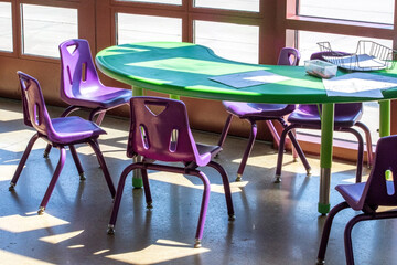 empty child size table and chairs at a small preschool